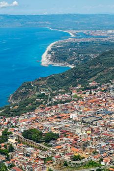 aerial view of the landscape of the Calabrian coast in Italy, you can see the port of Gioa Tauro and the neighboring countries, travel reportage