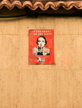 Benidorm, Alicante, Spain- September 11, 2022: Poster on the wall requesting night silence for the neighborhood