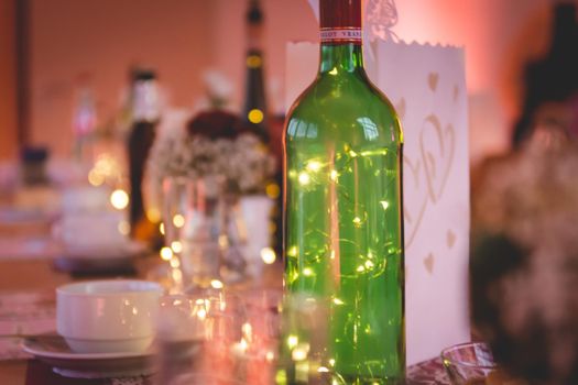 A closeup shot of decorations on a table with fairy lights