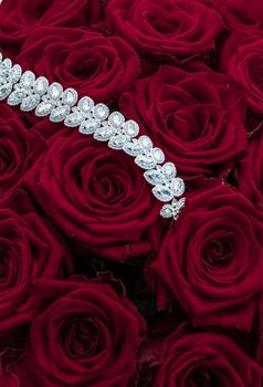 Luxe branding, glamour fashion and boutique shopping concept - Luxury diamond jewelry bracelet and red roses flowers, love gift on Valentines Day and jewellery brand holiday background design