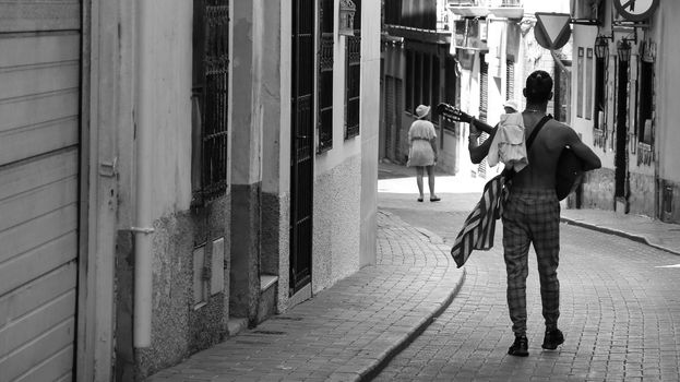 Benidorm, Alicante, Spain-September 11, 2022: Musician playing flamenco music with Spanish Guitar on the street in Benidorm