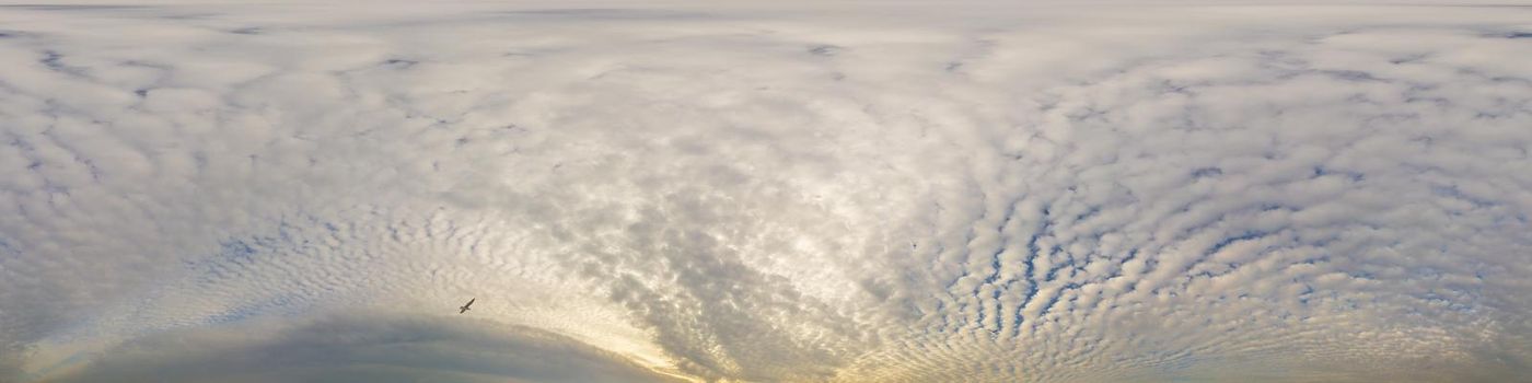 Sky panorama on overcast rainy day with low clouds in seamless spherical equirectangular format. Complete zenith for use in 3D graphics, game and for aerial drone 360 degree panorama as a sky dome.