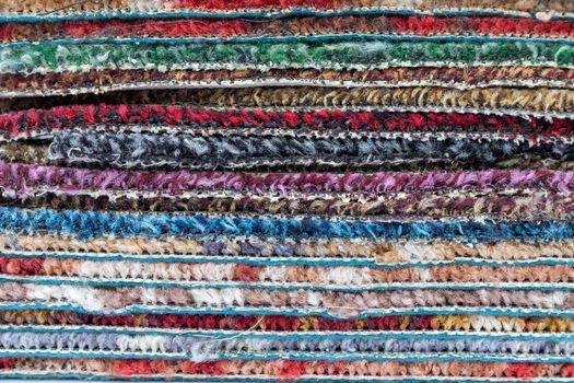 Multi colored rug or carpet stack over each other. colorful texture background