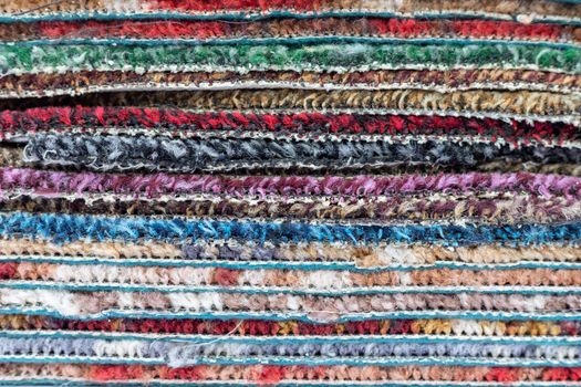 Stack of carpet of multi colors texture background