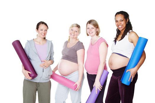 Pregnancy yoga boosts their wellbeing. Pregnant friends standing together and holding their yoga mats while isolated on white