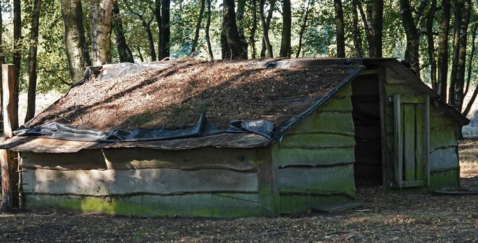 Old sheepfold in the shade.It is constructed from rough planks. Location: Springendal, the Netherlands