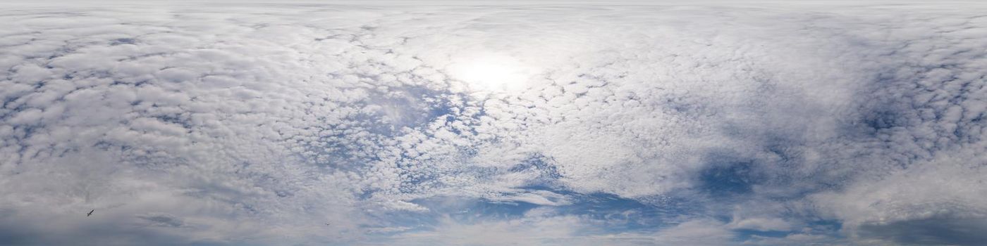 Blue sky with Cumulus clouds Seamless panorama in spherical equirectangular format. Complete zenith for use in 3D graphics, game and for composites in aerial drone 360 degree panoramas as a sky dome.