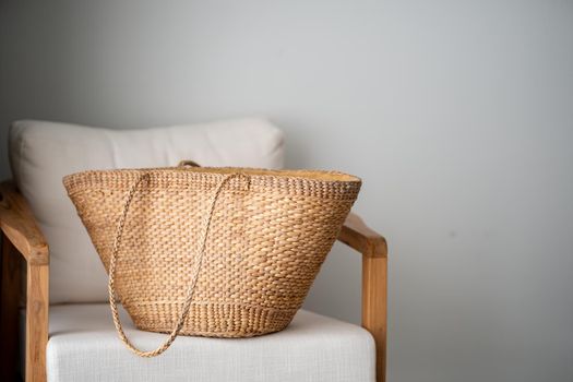 Wicker basket on chair indoors room.