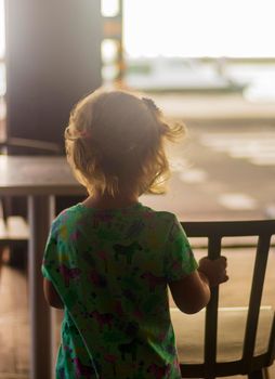 Little girl looking at the road