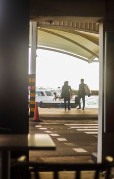 Male, Maldives 04.23.2021 - Couple boarding the boat after flight at Velana international airport