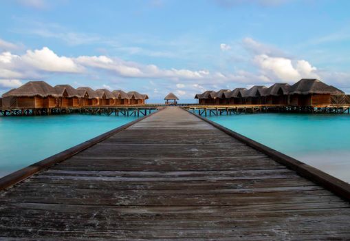 Shot of a over water bungalows on tropical island