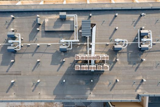 air ventilation flow system on the roof of the building. vent pipe fan HVAC. 