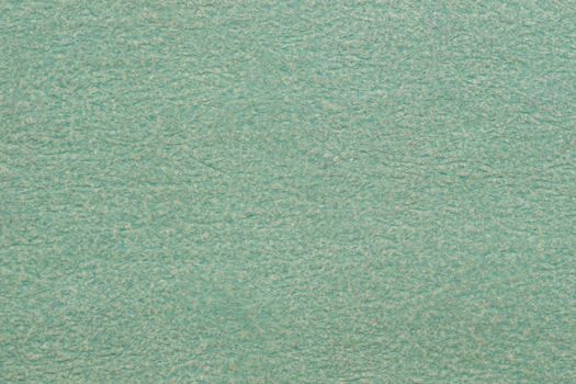 Textured background made of green kraft paper. 