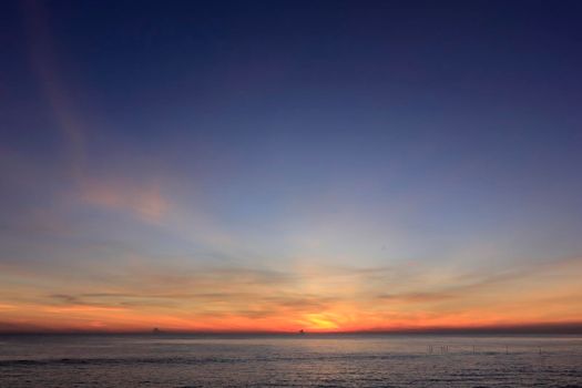 photograph of the sunrise from the sea and the beautiful sky and morning clouds