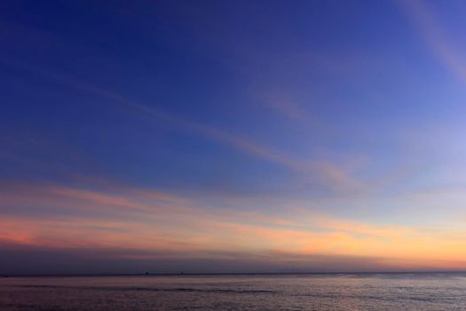 photograph of the sunrise from the sea and the beautiful sky and morning clouds