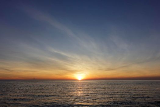 photograph of the sunrise from the sea and the beautiful sky and morning clouds