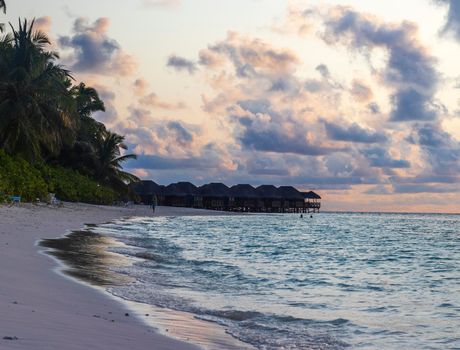 Shot of a over water bungalows on tropical island