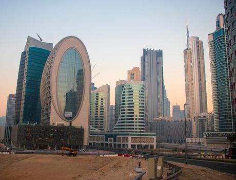 Dubai, UAE - 01.15.2021 Morning hour in Business bay district , Marasi drive. Burj Khalifa, tallest building in the world can be seen in the scene