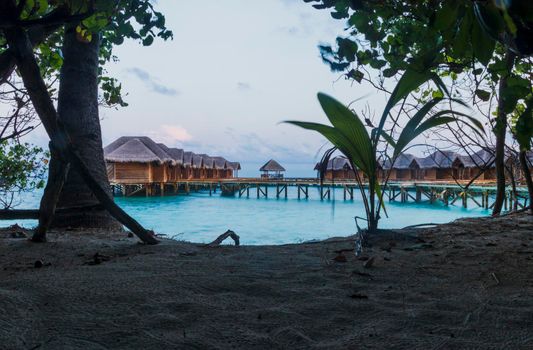 Shot of a over water bungalows on tropical island