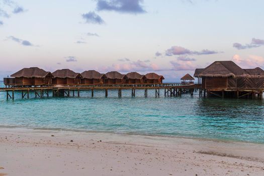 Shot of a over water bungalows on tropical island