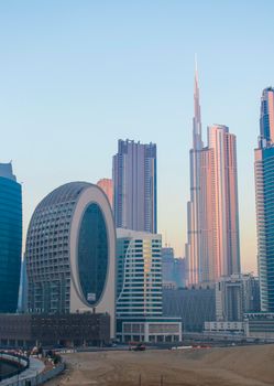 Dubai, UAE - 01.15.2021 Morning hour in Business bay district , Marasi drive. Burj Khalifa, tallest building in the world can be seen in the scene