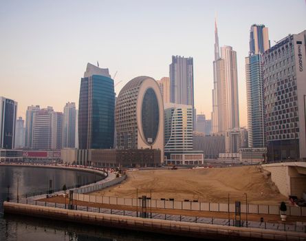 Dubai, UAE - 01.15.2021 Morning hour in Business bay district , Marasi drive. Burj Khalifa, tallest building in the world can be seen in the scene