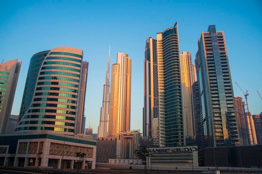 Dubai, UAE - 01.15.2021 Morning hour in Business bay district , Marasi drive. Burj Khalifa, tallest building in the world can be seen in the scene