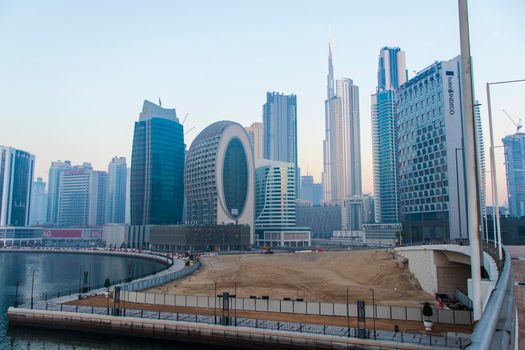 Dubai, UAE - 01.15.2021 Morning hour in Business bay district , Marasi drive. Burj Khalifa, tallest building in the world can be seen in the scene