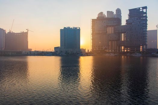 Dubai, UAE - 01.15.2021 Sunrise over a Dubai water canal