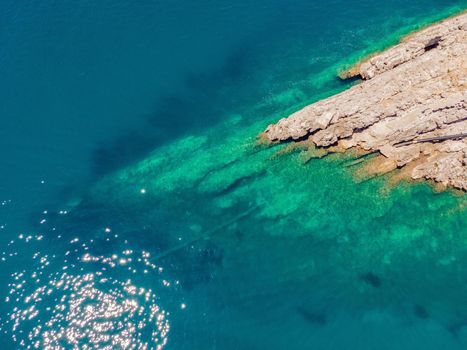 The pipe drains the sewer into the sea. Environmental pollution. Drone view.