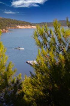 rowing team paddles on the tranquil sea. High quality photo