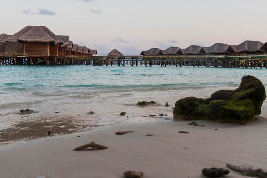 Shot of a over water bungalows on tropical island