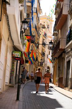 Benidorm, Alicante, Spain- September 10, 2022: Streets and facades adorned with colorful rainbow flags for The Gay Pride in Benidorm