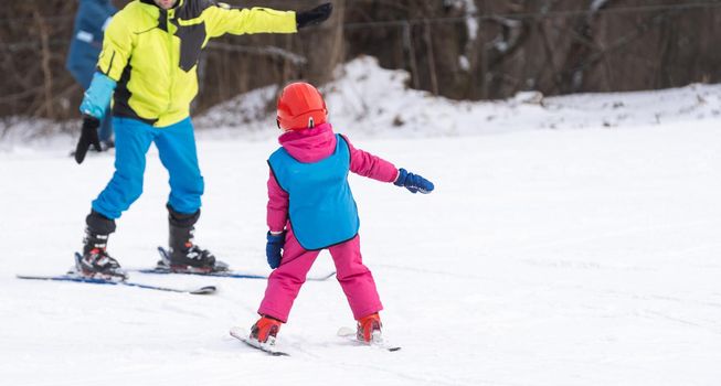 skiing master class for kids with instructor in winter sports school for children