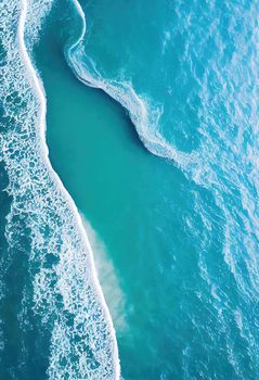 Beach and waves from above. ater background from the top. Summer attacks from the air. Aerial view of a blue ocean