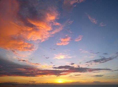 idyllic landscape blue sky at sunset sunrise in yellow red brown and fiery colors in autumn or spring. High quality photo