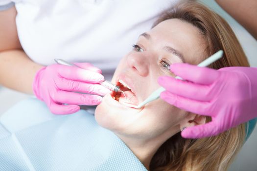 Close up of a mature woman getting dental examination