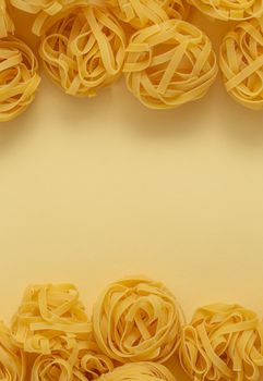 Minimal food pattern of pasta tagliatelle, light yellow pastel background with space for text. Traditional Italian pasta in pop art style, Italian cuisine concept. Top view, flat lay, copy space