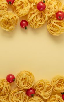 Minimal food pattern tagliatelle and tomatoes, light yellow pastel background. Traditional Italian pasta in pop art style. Pasta and tomatoes, Italian cuisine concept. Top view, flat lay, copy space