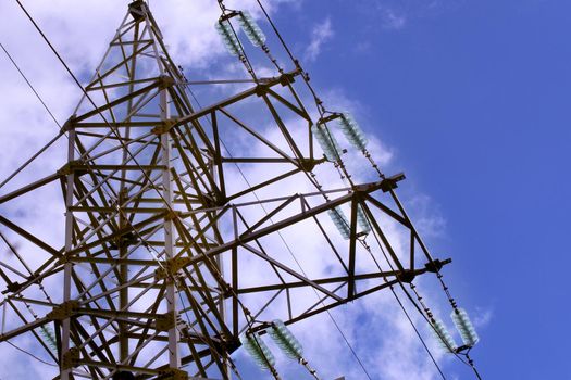 Power plant tower close-up against the blue sky. Energy crisis concept.