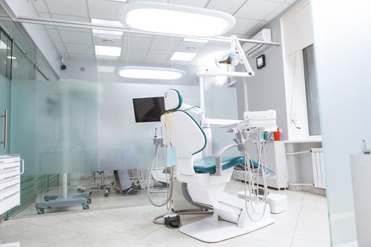 Dentists office with empty dental chair, copy space