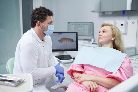 Mature woman having dental appointment at dentists office