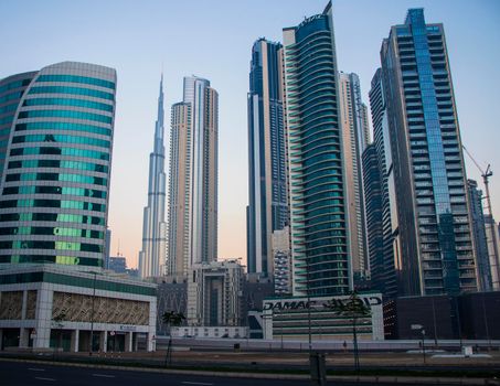 Dubai, UAE - 01.15.2021 Morning hour in Business bay district , Marasi drive. Burj Khalifa, tallest building in the world can be seen in the scene