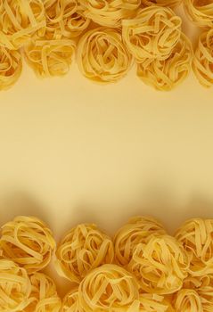 Minimal food pattern of pasta tagliatelle, light yellow pastel background with space for text. Traditional Italian pasta in pop art style, Italian cuisine concept. Top view, flat lay, copy space