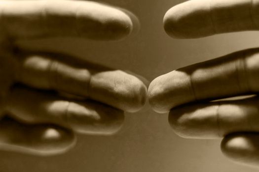 Close up shot of a hand's reflection in the mirror