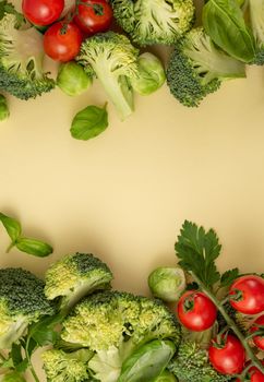 Vegetables food pattern made of broccoli, Brussels sprouts, tomatoes, herbs on light pastel background. Minimal flat lay design, nutrition, healthy eating, diets, vitamins. Top view, space for text