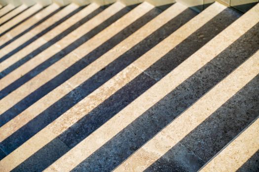 Staircase in the city, black and white pattern on the stairs on a sunny day