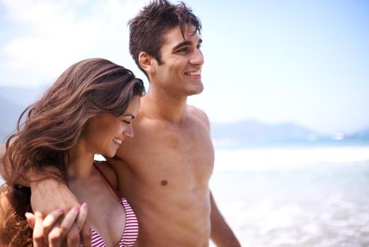 Its romance in paradise. a young couple enjoying a beach getaway