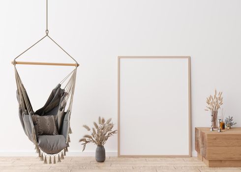 Empty vertical picture frame standing on parquet floor in modern living room. Mock up interior in scandinavian, boho style. Free space for picture. Vases with dried grass, hanging chair. 3D rendering