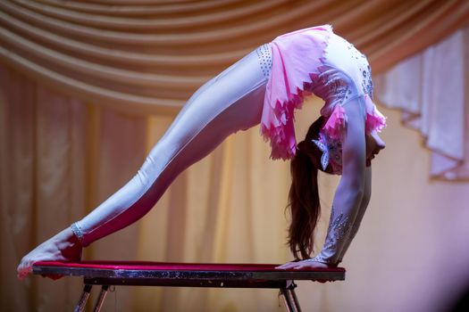 Flexible girl gymnast.